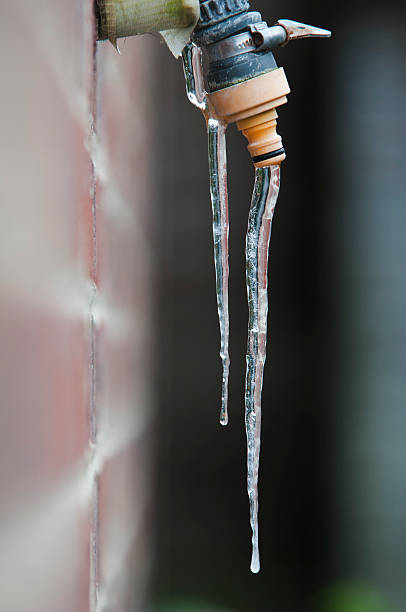 istock outside water tap with frozen drips 153762407