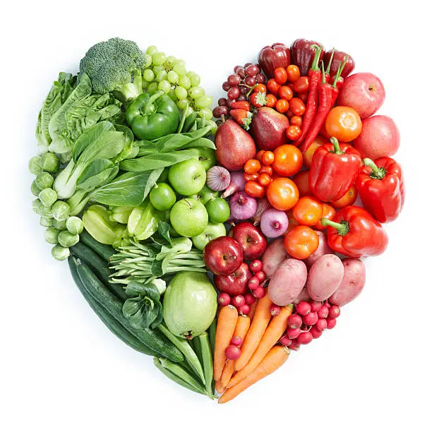 Photo of Heart shaped display of green, red healthy foods