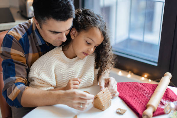 istock Multiracial family joyfully making Christmas cookies 1537637359