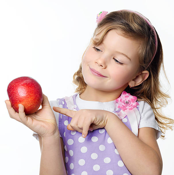 istock girl with apple 153764027