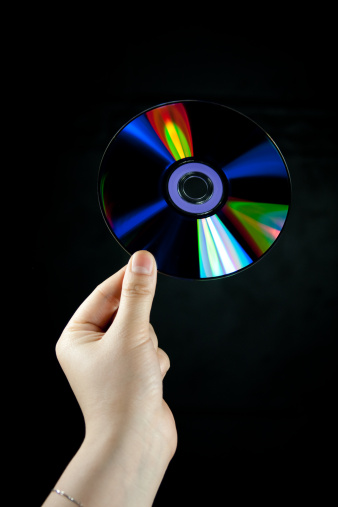 cd disc with a woman's handcd disc with a woman's hand