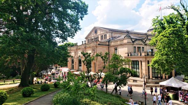 Wiesbaden, Germany - June 10, 2023:\n\nThe Kurhaus is the spa house in Wiesbaden, the capital of Hesse, Germany. It serves as the city's convention center, and the social center of the spa town.  Many restaurants and cafes could be found inside as well as outside. Green environments around is very pleasant for walking, resting, and relaxing.