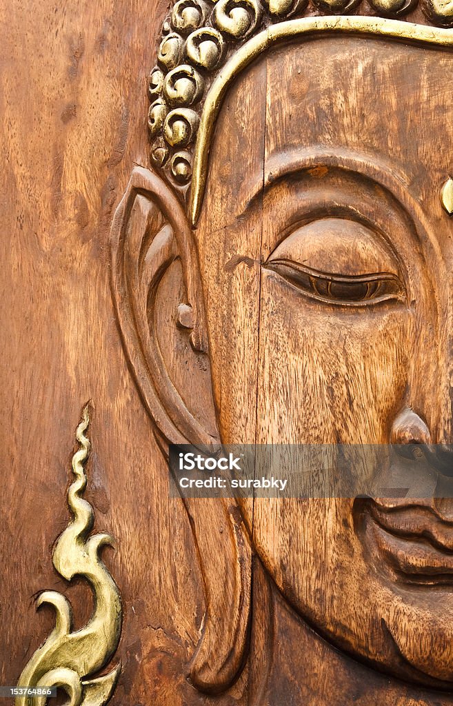 Buddha' face, carving from teak wood in Thai style Face of Lord Buddha, engraved from teak wood Art Stock Photo