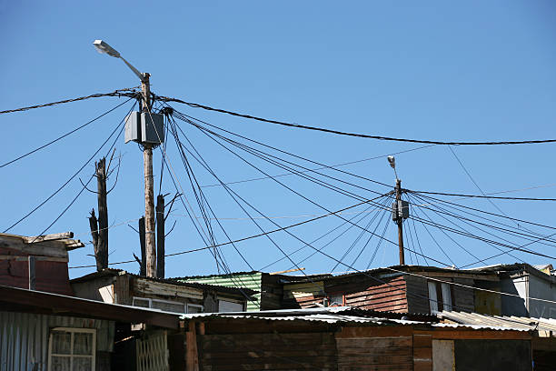 electric cables to shacks stock photo