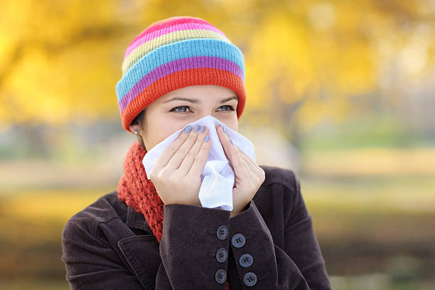 istock Woman with tissue having flu or allergy 153765614