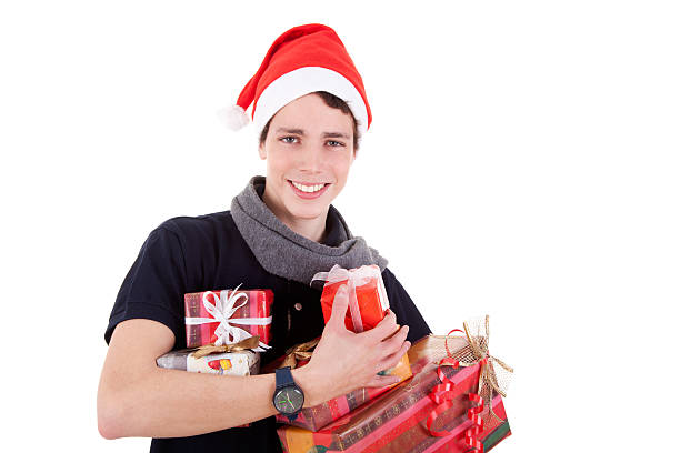 Happy christmas young man with a gifts stock photo