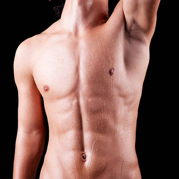 torso of a sweat man in topless stock photo