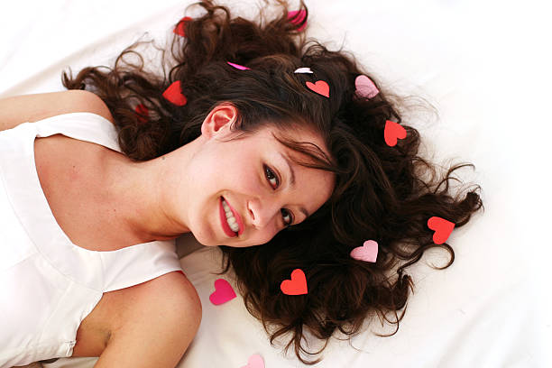 istock Beautiful young woman smiles while laying 153766040