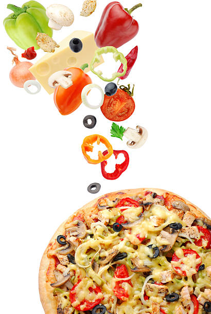 istock A selection of fresh ingredients falling onto a pizza 153766098