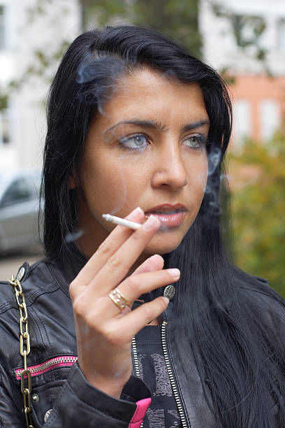 istock Girl smoking outdoors 153766439