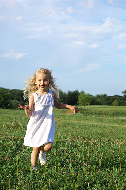 istock happy little girl running 153766881