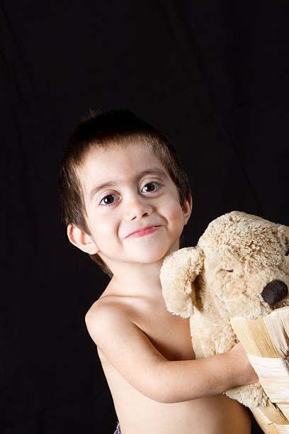 istock Little boy playing with his puppet dog in wicker basket 153767367