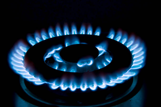 Single large burner alight on a hob stock photo