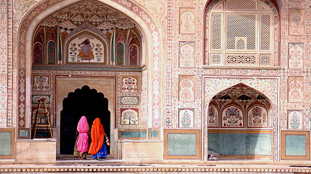 Woman in Amber fort Two women walking in the Amber Fort, Jaipur jaipur stock pictures, royalty-free photos & images