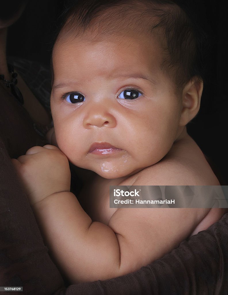 Portrait of black baby girl with blue eyes Adorable three month old baby girl of Caucasian and African American heritage. Newborn Stock Photo