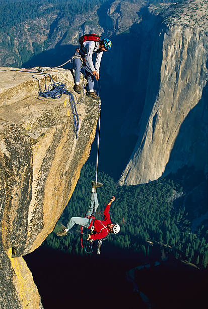 Rock climbers in trouble. stock photo