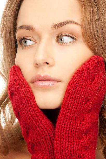 istock beautiful woman in red mittens 153768651