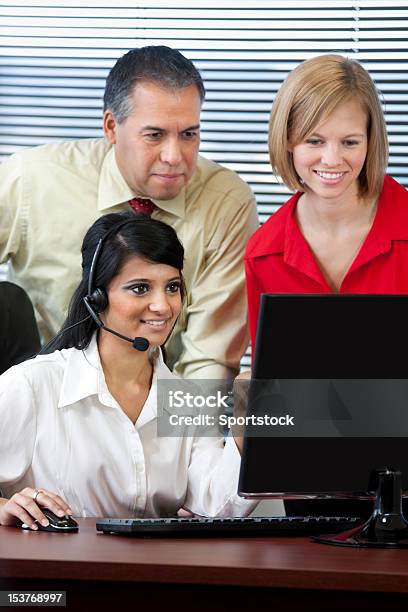 Business Team Looking At Computer Screen Stock Photo - Download Image Now - Adults Only, Asian and Indian Ethnicities, Assistance