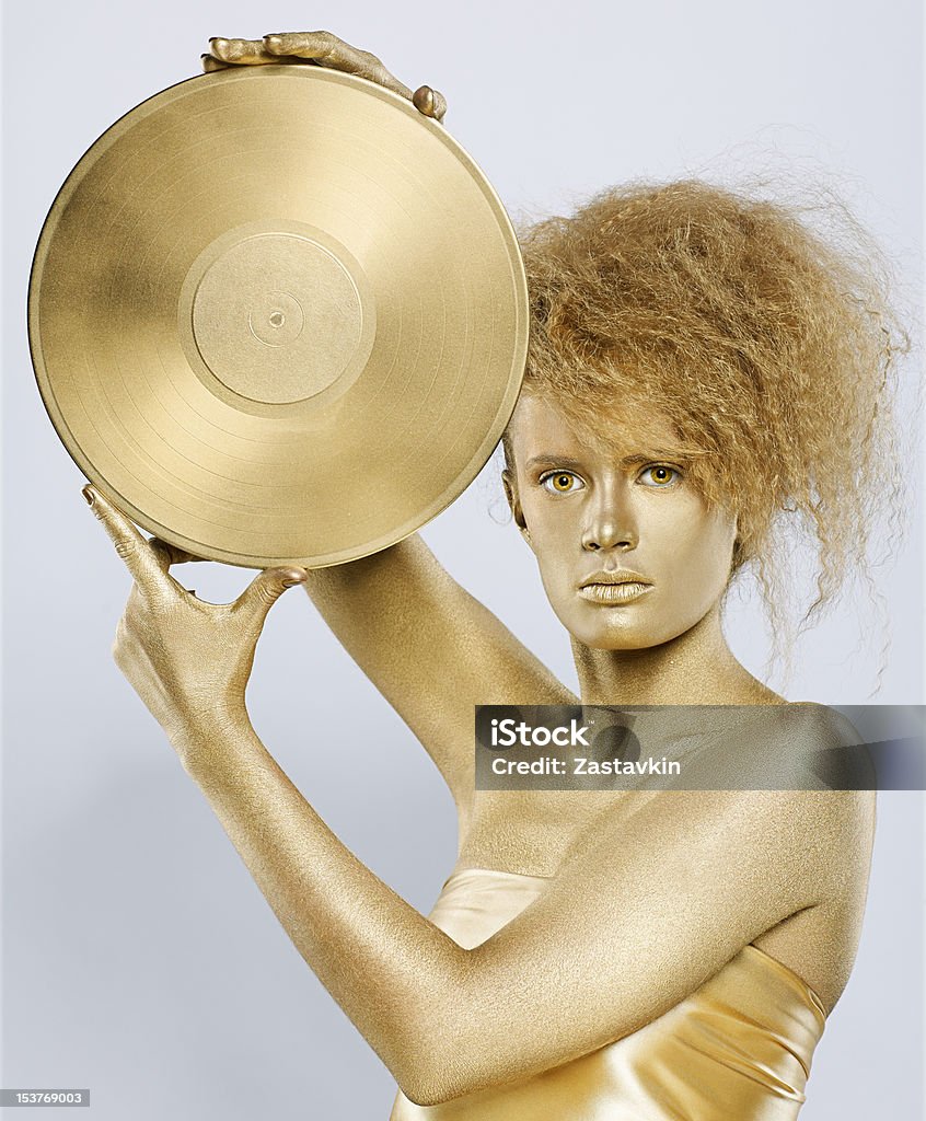 golden Mädchen mit vinyl - Lizenzfrei Attraktive Frau Stock-Foto