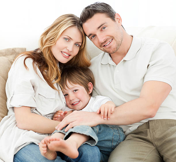 istock Happy family on their sofa 153769119