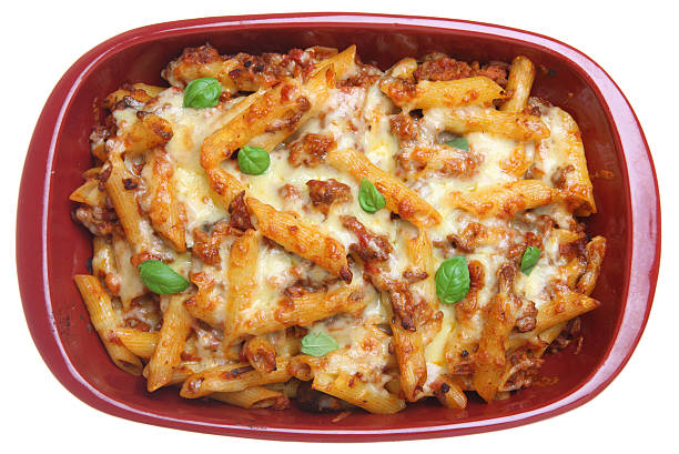 Rigatoni Pasta Bake Baked rigatoni pasta with bolognese sauce and cheese rigatoni stock pictures, royalty-free photos & images