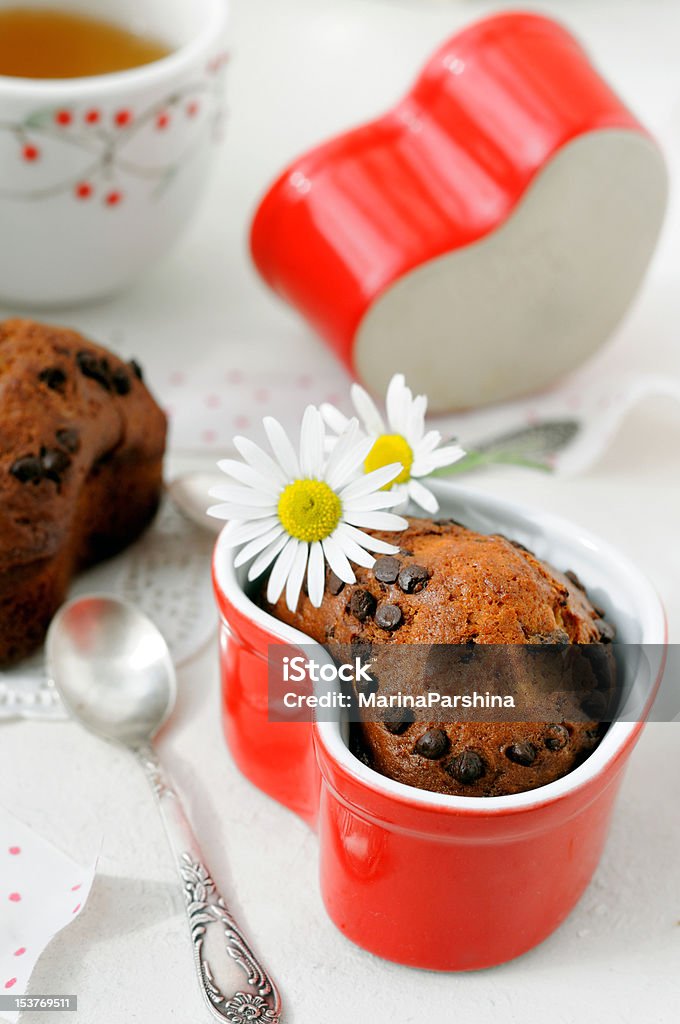 Banana chocolate muffins Just baked fruit chocolate muffins in heart shaped capcakes. Affectionate Stock Photo