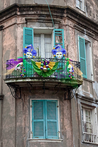 Mardi Gras Window Window balcony in New Orleans dressed out for Mardi Gras new orleans mardi gras stock pictures, royalty-free photos & images