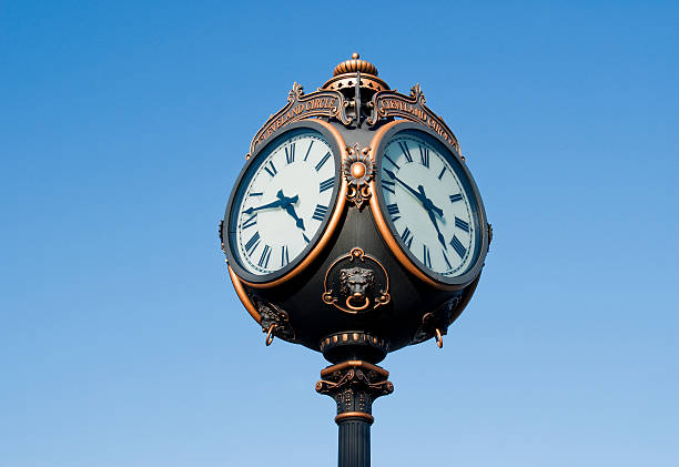 istock Outdoor clock against blue sky, isolated 153770055