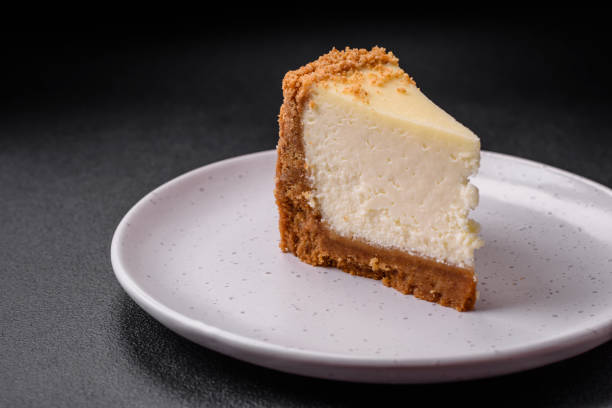 istock Delicious sweet cheesecake cake on textured concrete background 1537702348