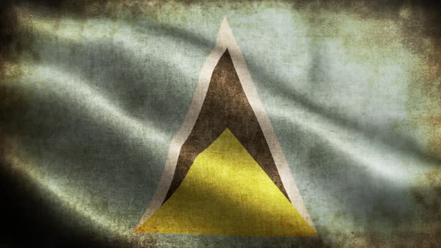 Closeup of grunge Saint Lucia waving flag loopable stock video