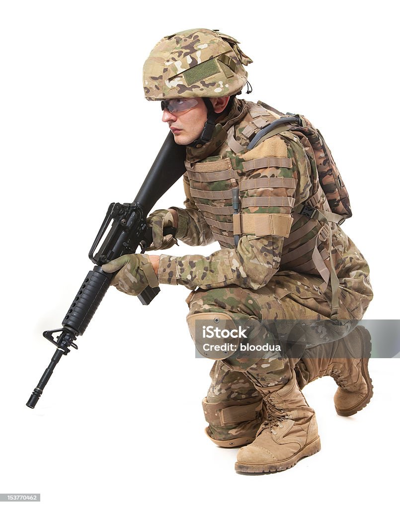 Soldado con un arma moderna - Foto de stock de Accesorio de cabeza libre de derechos