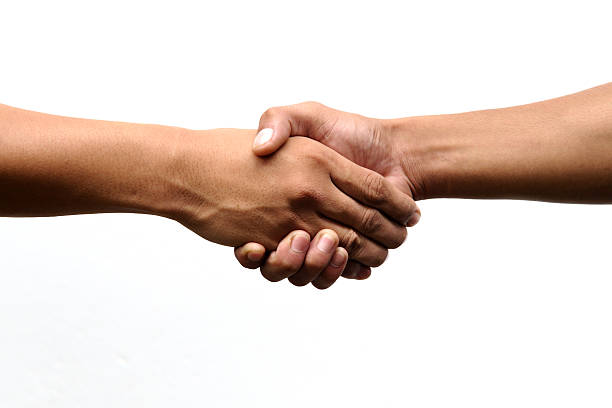 istock Closeup of people shaking hands 153770501