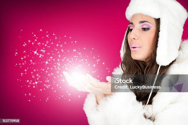 Winter Woman Blowing Snowflakes Stock Photo - Download Image Now - One Woman Only, Pink Color, Sensuality