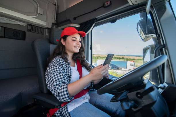 istock Female trucker relaxing in the cabin and using technology. 1537709922