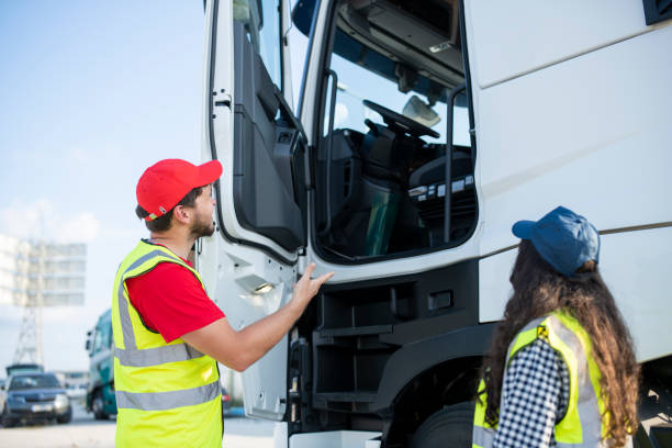 istock Two truck drivers having a discussion. 1537710197