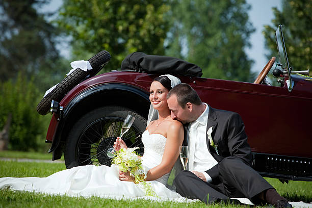 istock wedding couple with olt car 153771541