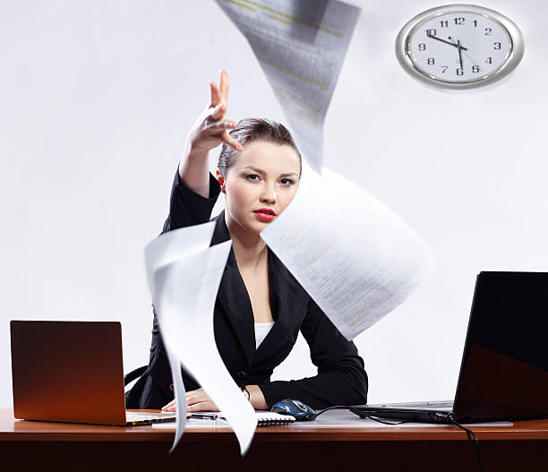 istock businesswoman with two laptops 153771819