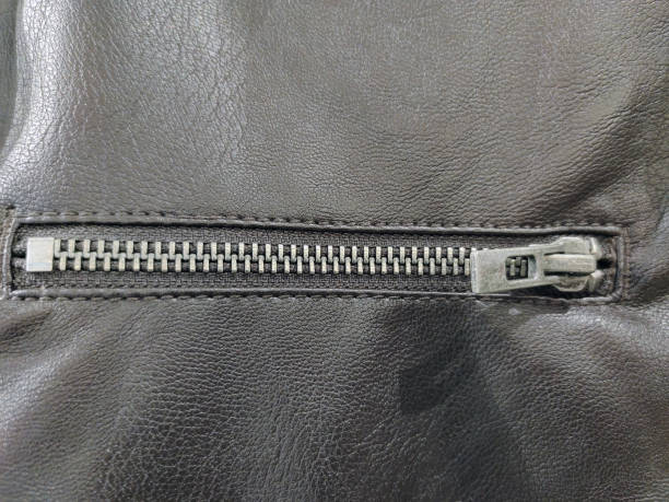 istock Close-up of a horizontal zipper on a leather garment 1537724121