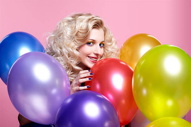 istock blonde girl with balloons 153772749