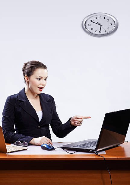 istock businesswoman with two laptops 153772905