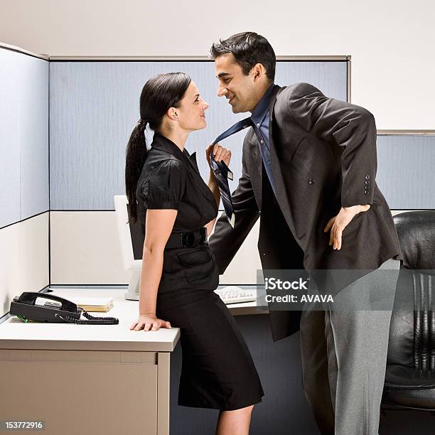 Coworkers Kissing In Office Cubicle Stock Photo - Download Image Now - Office, Sensuality, Couple - Relationship