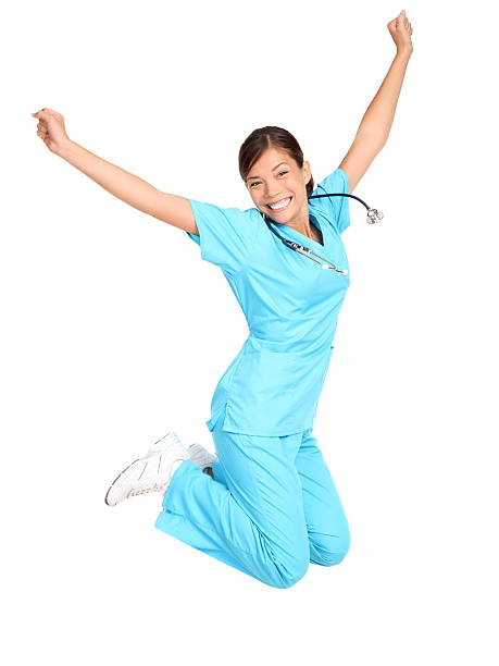 infirmière heureux de sauter - arms outstretched arms raised studio shot adult photos et images de collection