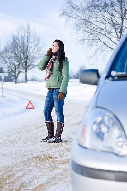 istock Winter car breakdown - woman call for help 153773171