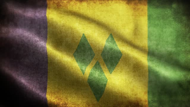 Closeup of grunge St. Vincent and the Grenadines waving flag loopable stock video