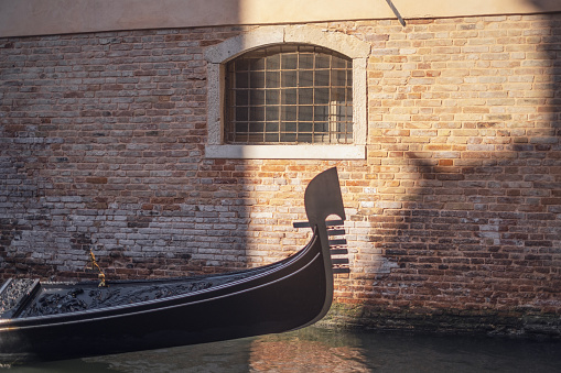 Close-up of luxurious Gondola with beautiful details and reflections in the water.
