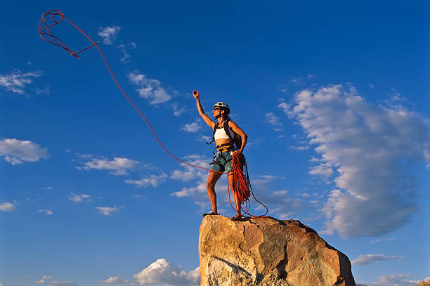 istock Female rock climber rappelling. 153773545