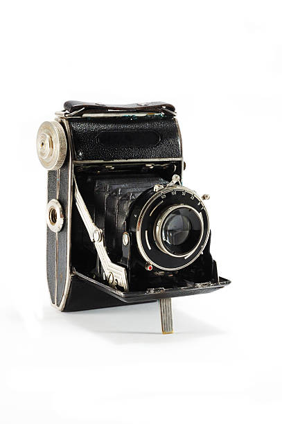 istock Old film photo camera on white background 153773643
