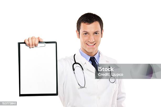 Smiling Doctor Holding A White Blank Card Stock Photo - Download Image Now - Adult, Adults Only, Beautiful People