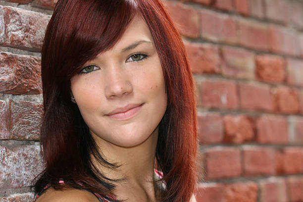 istock Girl agaist Brick Wall 153774149