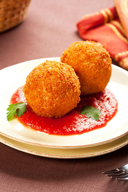 arancini - tomato stuffed two objects plate стоковые фото и изображения